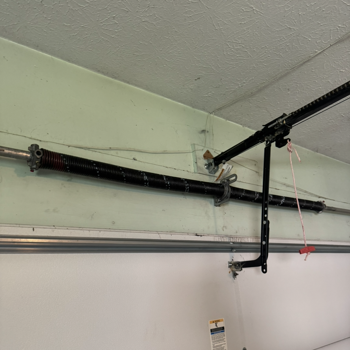 Newly installed torsion spring on a garage door in Mentor, OH